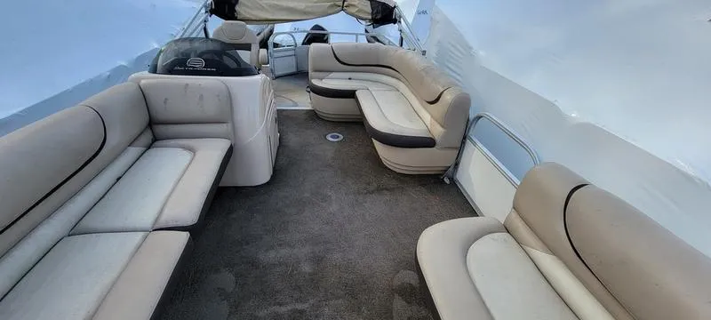 Slide: The Image of 2016 Sun Tracker PB 22 RF pontoon boat interior with beige seating and carpet. - 3