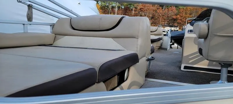 Slide: The Image of 2016 Sun Tracker PB 22 RF pontoon boat interior with beige seating. - 4
