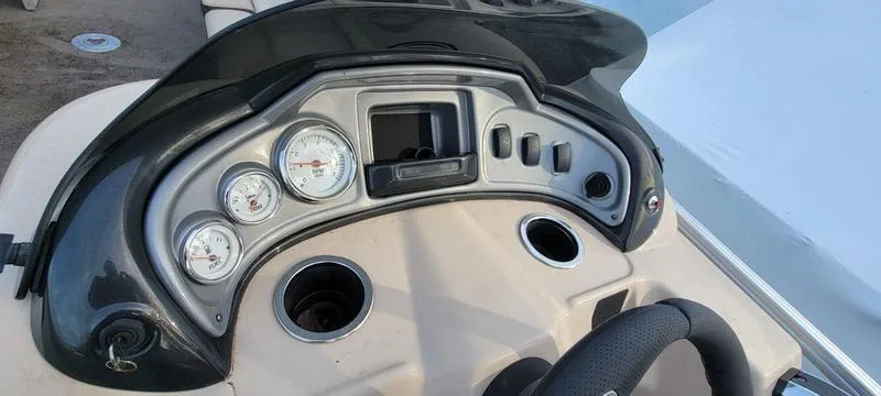 Slide: The Image of 2016 Sun Tracker PB 22 RF boat dashboard with gauges and controls. - 9