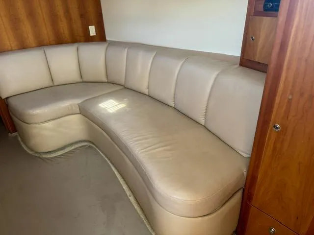 Slide: The Image of Beige leather seating in 2002 Silverton 330 Sport Bridge interior. - 11