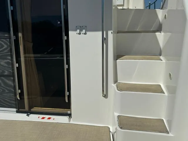 Slide: The Image of Staircase and sliding door on 2002 Silverton 330 Sport Bridge yacht. - 3