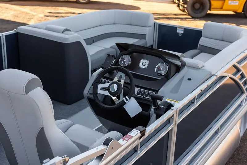 Slide: The Image of 2025 Godfrey Monaco 235 SFL boat interior with modern dashboard and seating. - 14