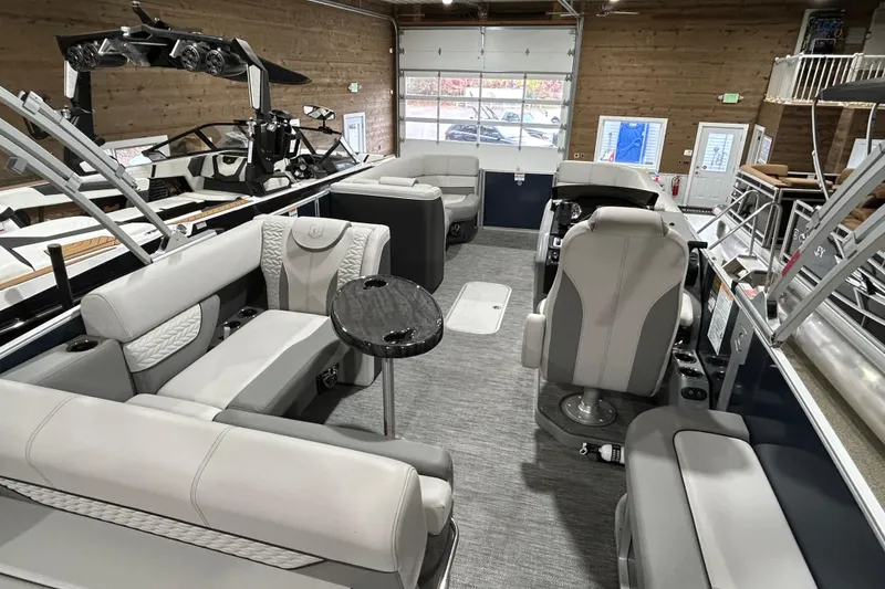 Slide: The Image of 2025 Godfrey Monaco 235 SFL boat interior with luxurious seating and modern design. - 15