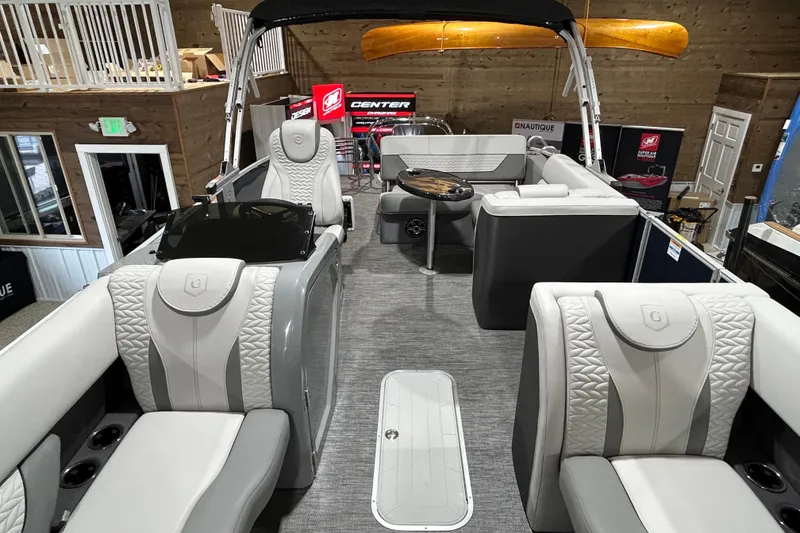 Slide: The Image of 2025 Godfrey Monaco 235 SFL pontoon boat interior with luxurious seating and modern design. - 16
