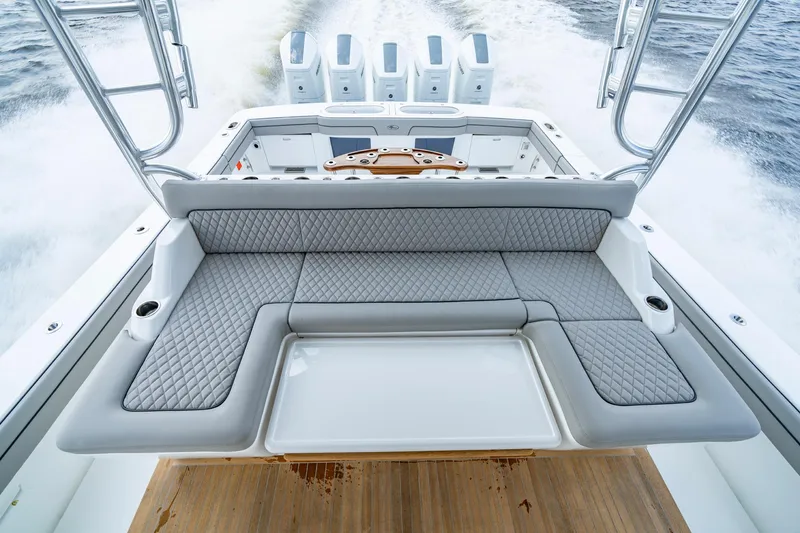 Slide: The Image of 2024 Valhalla V-55 Center Console boat with luxurious seating and powerful engines. - 11