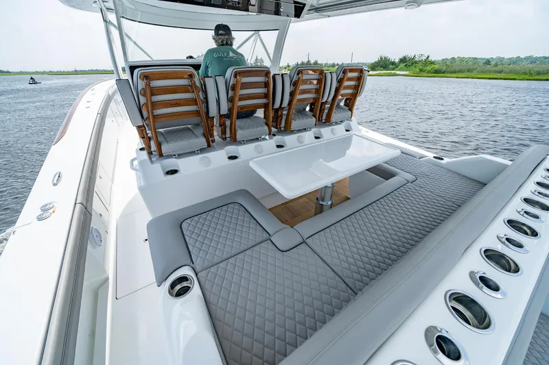 Slide: The Image of 2024 Valhalla V-55 Center Console boat with luxurious seating and sleek design on the water. - 14