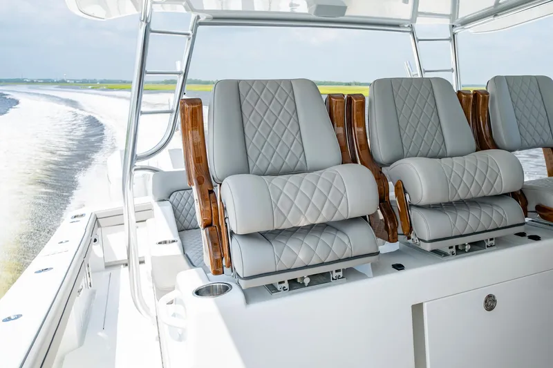 Slide: The Image of 2024 Valhalla V-55 Center Console with luxurious quilted seating on deck. - 15