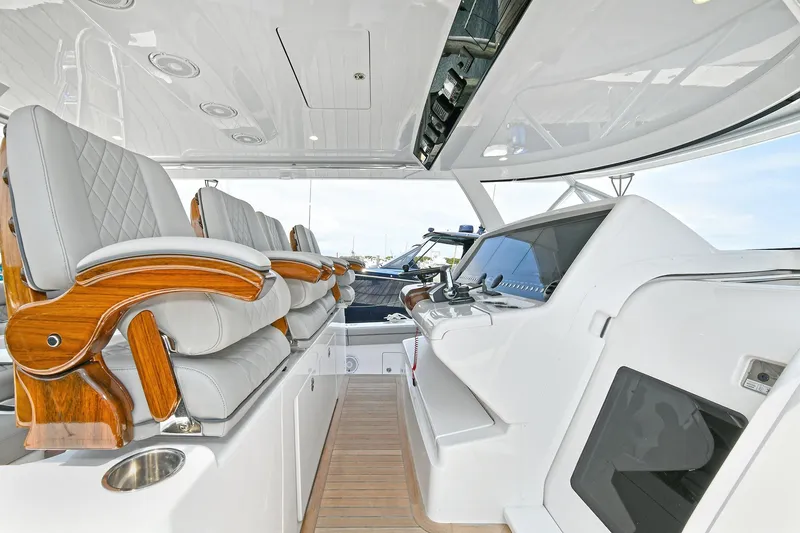 Slide: The Image of 2024 Valhalla V-55 Center Console interior with luxurious seating and modern helm design. - 16