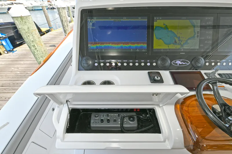 Slide: The Image of 2024 Valhalla V-55 Center Console dashboard with navigation screens and control panel. - 17