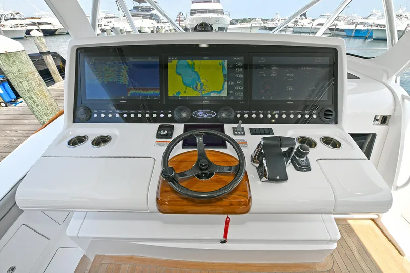 Slide: The Image of 2024 Valhalla V-55 Center Console helm with advanced navigation displays and controls. - 19