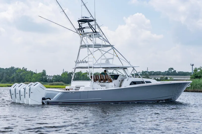 Slide: The Image of 2024 Valhalla Boatworks V-55 Center Console on water, featuring multiple outboard engines. - 2