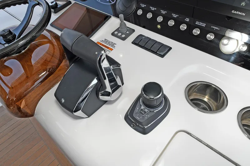 Slide: The Image of 2024 Valhalla V-55 Center Console helm with controls and navigation equipment. - 20
