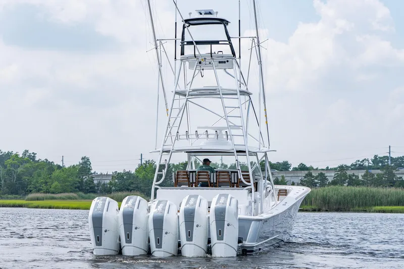 Slide: The Image of 2024 Valhalla V-55 Center Console boat with five powerful outboard engines on the water. - 3