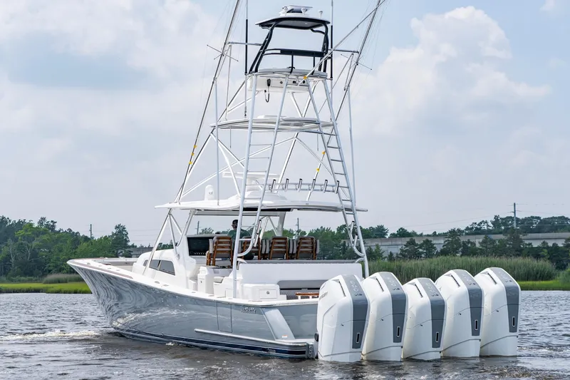 Slide: The Image of 2024 Valhalla Boatworks V-55 Center Console with multiple outboard engines on the water. - 4
