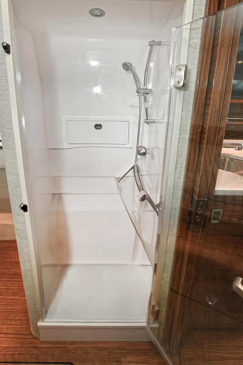 Slide: The Image of 2024 Valhalla V-55 Center Console shower with glass door and modern fixtures. - 43