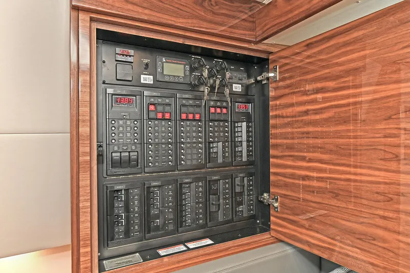 Slide: The Image of Electrical panel inside 2024 Valhalla V-55 Center Console boat, featuring advanced controls. - 44