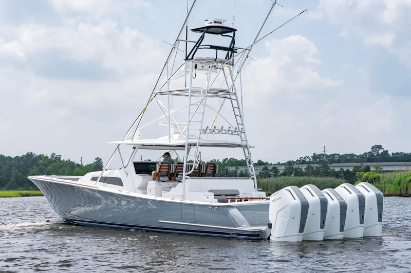 Slide: The Image of 2024 Valhalla V-55 Center Console boat with multiple outboard engines on the water. - 5