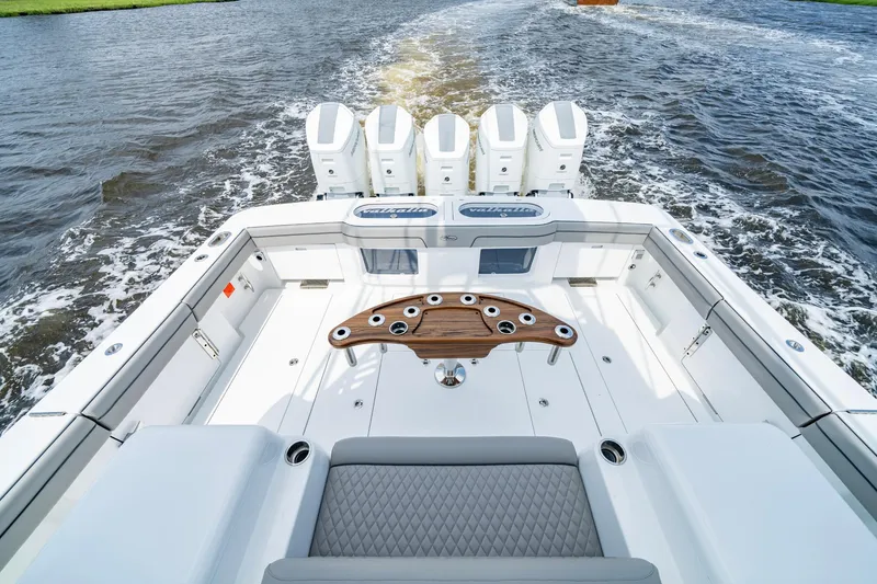 Slide: The Image of 2024 Valhalla V-55 Center Console boat with quad engines on open water. - 8