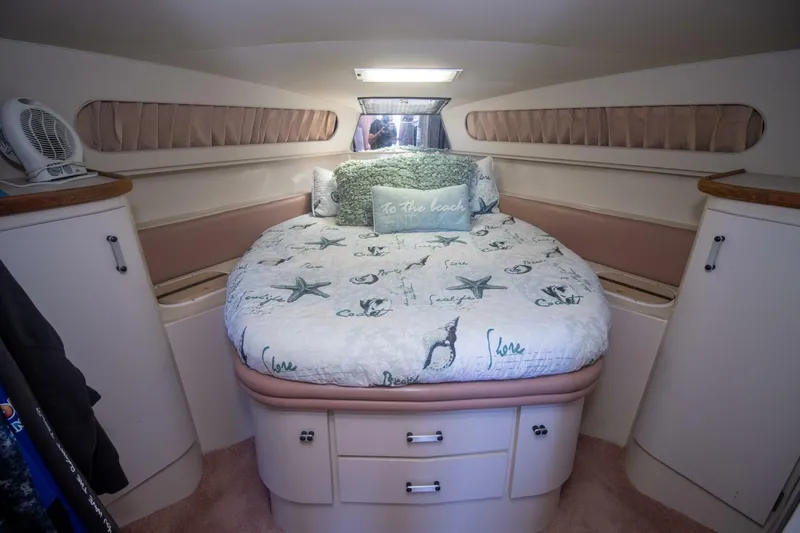 Slide: The Image of Cozy bedroom in 1989 Carver 340 Santego yacht with nautical-themed bedding. - 24