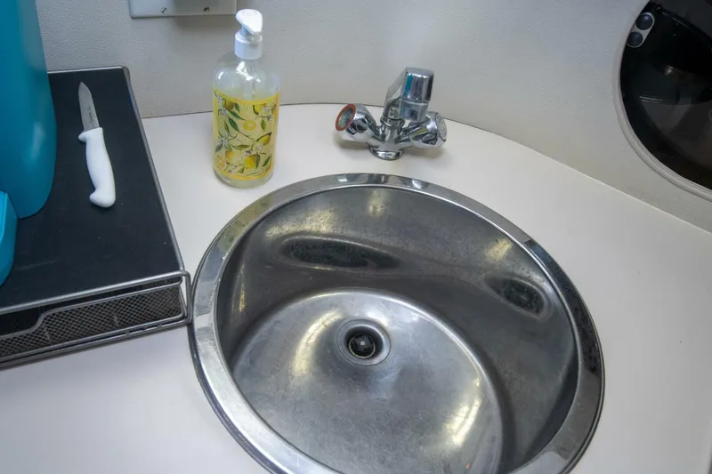 Slide: The Image of Stainless steel sink in 1989 Carver 340 Santego boat bathroom. - 18