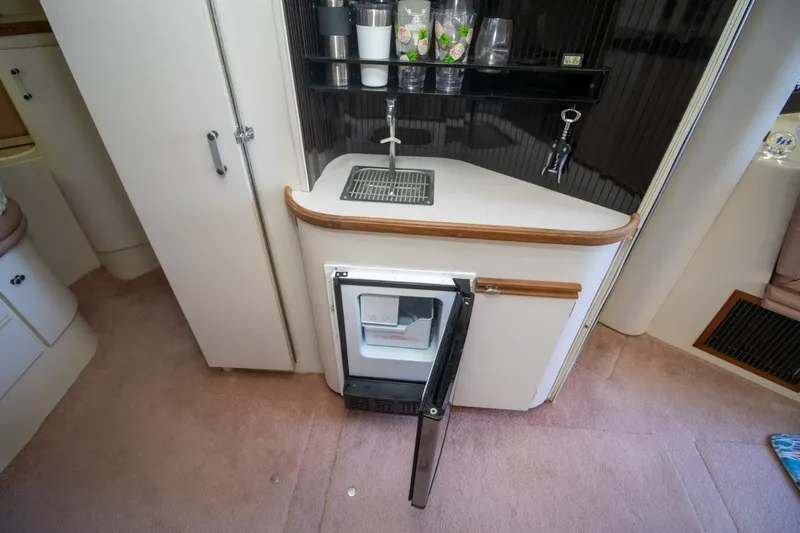 Slide: The Image of 1989 Carver 340 Santego yacht kitchenette with sink and mini fridge. - 21