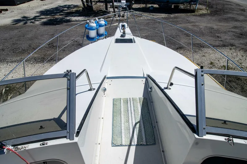 Slide: The Image of 1989 Carver 340 Santego yacht deck with open hatch and railing. - 8
