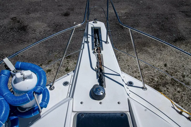 Slide: The Image of 1989 Carver 340 Santego boat deck with anchor and safety equipment. - 9