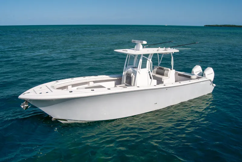 Slide: The Image of 2023 Front Runner 33 Center Console boat on open water. - 1