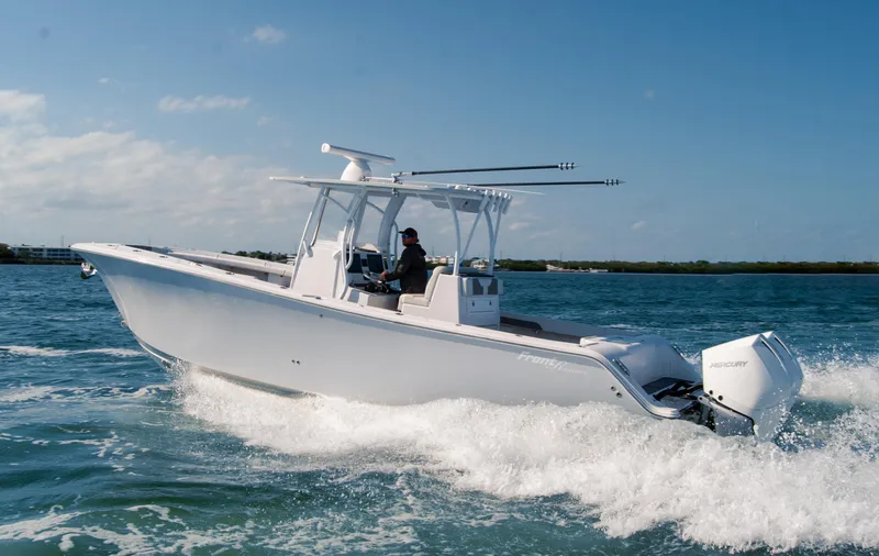 Slide: The Image of 2023 Front Runner 33 Center Console boat cruising on open water. - 10