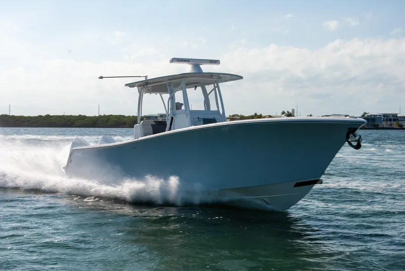 Slide: The Image of 2023 Front Runner 33 Center Console boat cruising on water. - 11