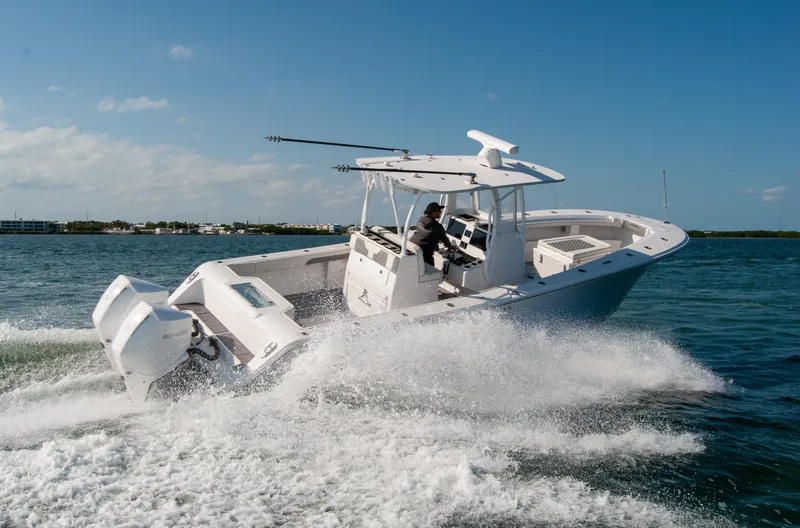 Slide: The Image of 2023 Front Runner 33 Center Console boat speeding on open water. - 12