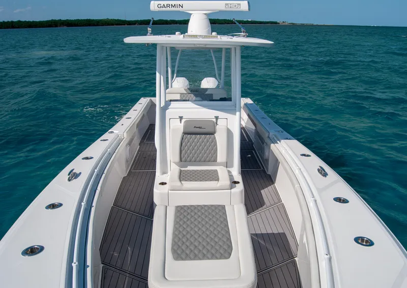Slide: The Image of 2023 Front Runner 33 Center Console boat on open water. - 15