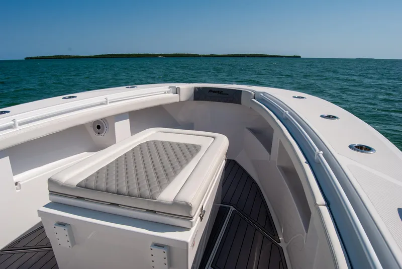 Slide: The Image of 2023 Front Runner 33 Center Console boat on open water, featuring sleek seating and modern design. - 17