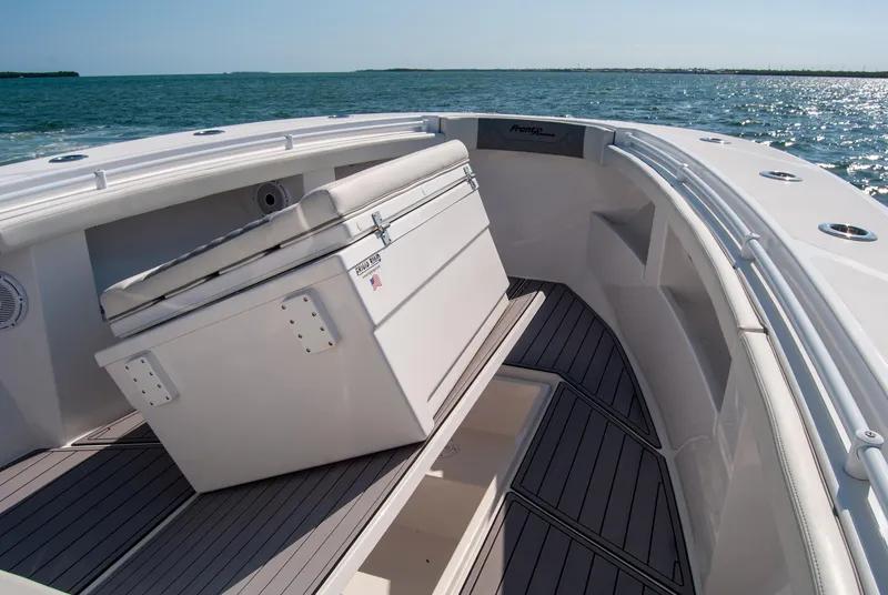 Slide: The Image of 2023 Front Runner 33 Center Console boat interior with seating, on open water. - 18