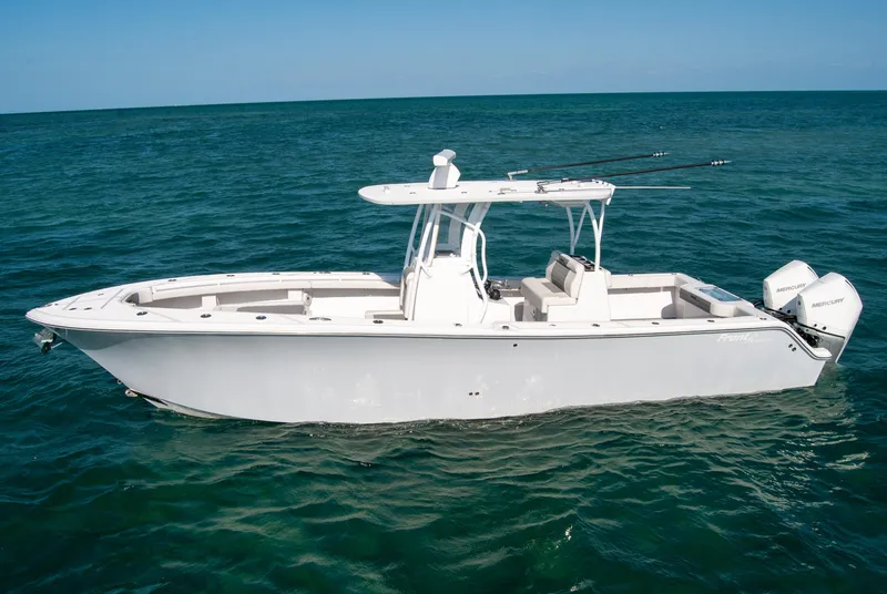 Slide: The Image of 2023 Front Runner 33 Center Console boat on open water. - 2
