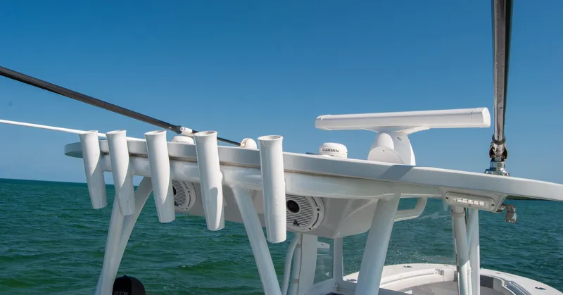 Slide: The Image of 2023 Front Runner 33 Center Console boat with rod holders on a sunny day. - 20