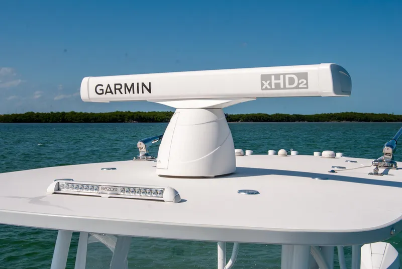 Slide: The Image of 2023 Front Runner 33 Center Console with Garmin xHD2 radar on open water. - 21