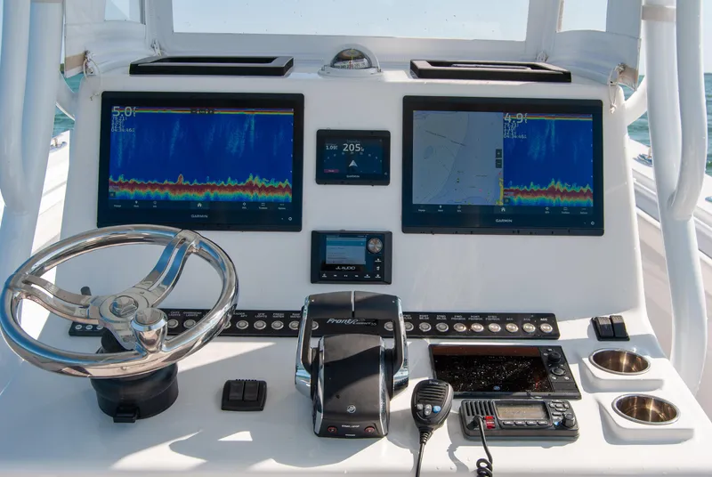 Slide: The Image of 2023 Front Runner 33 Center Console dashboard with advanced navigation and control systems. - 23