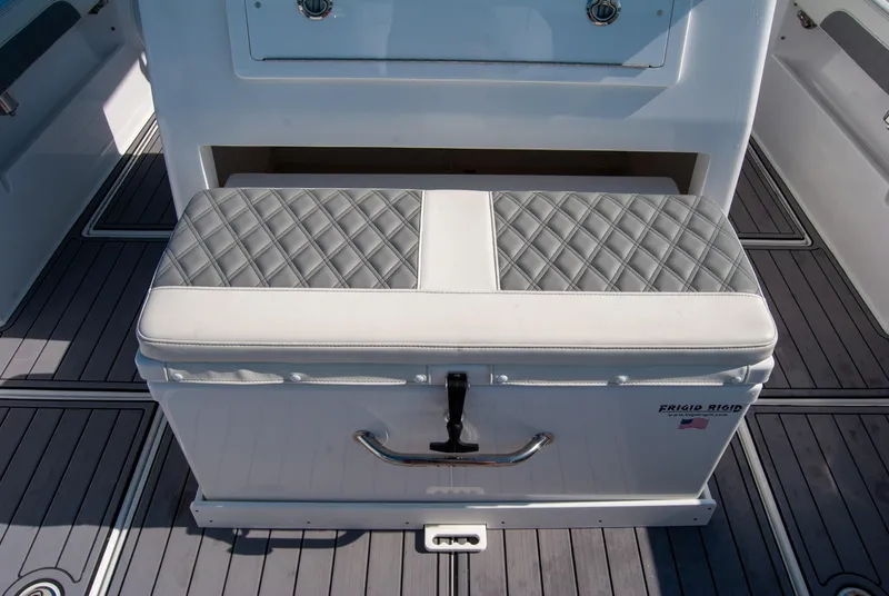 Slide: The Image of 2023 Front Runner 33 Center Console boat seat with quilted cushion and storage. - 25