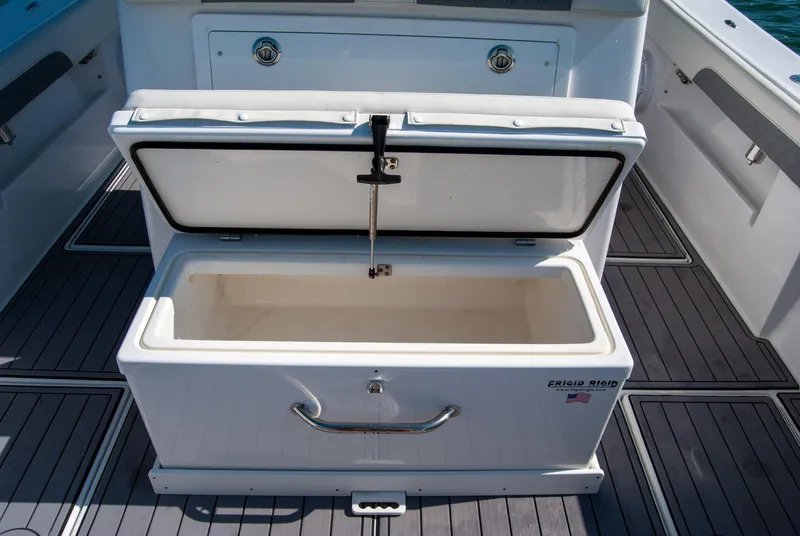 Slide: The Image of 2023 Front Runner 33 Center Console boat with open storage compartment. - 26