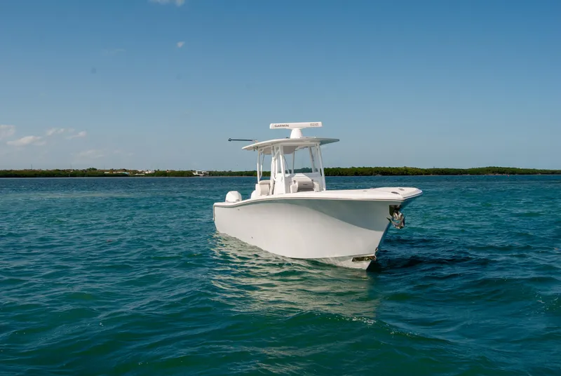 Slide: The Image of 2023 Front Runner 33 Center Console boat on clear blue water. - 3