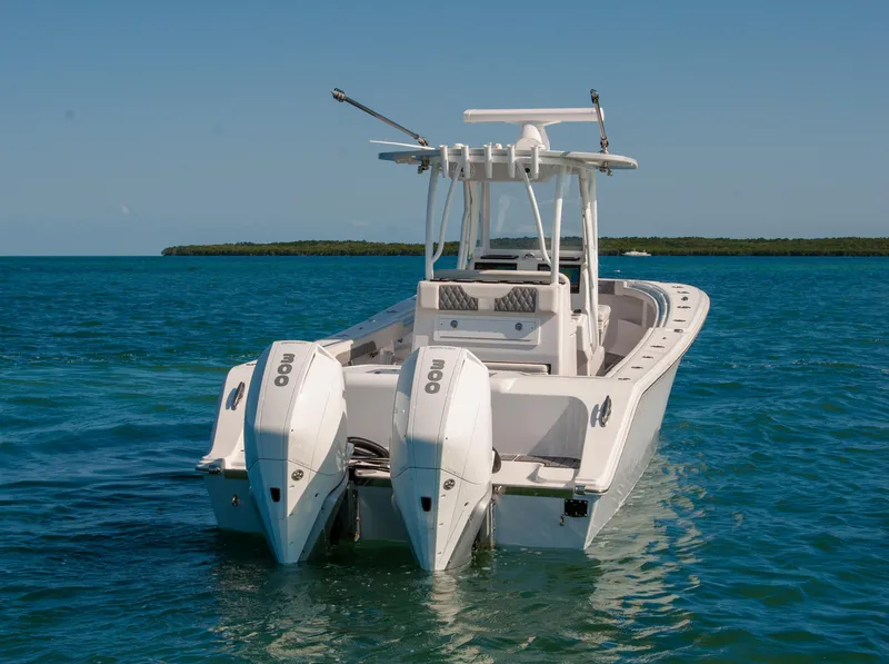 Slide: The Image of 2023 Front Runner 33 Center Console boat on clear blue water. - 6
