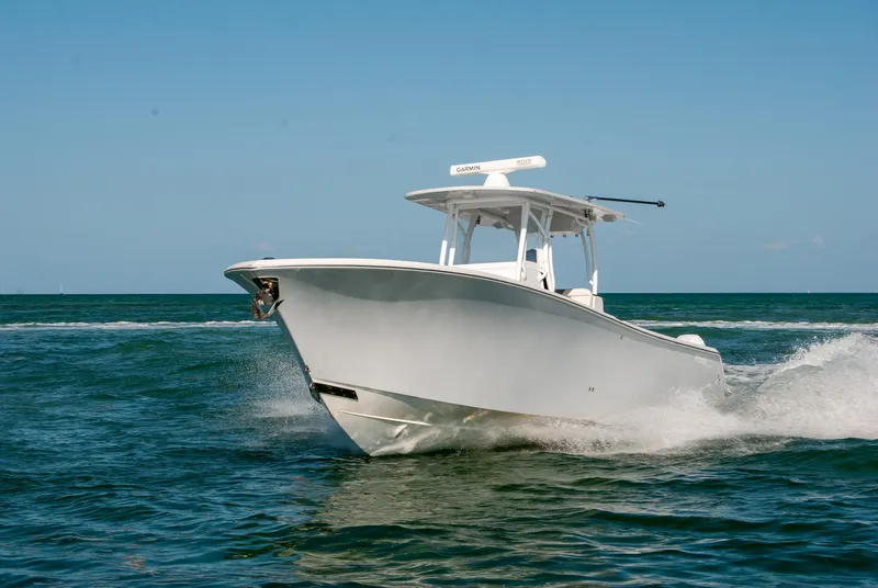 Slide: The Image of 2023 Front Runner 33 Center Console boat cruising on open water. - 7