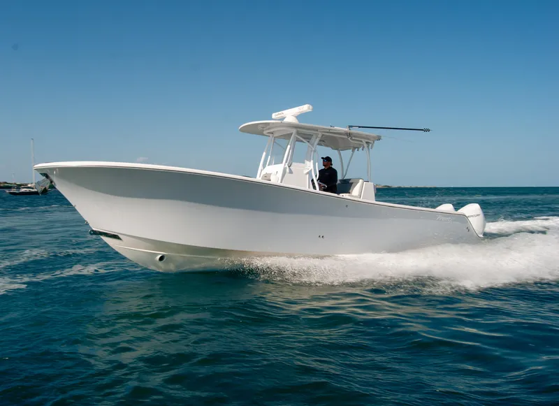 Slide: The Image of 2023 Front Runner 33 Center Console boat cruising on open water. - 8