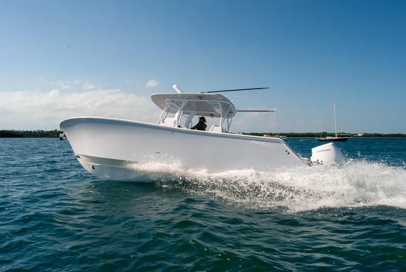 Slide: The Image of 2023 Front Runner 33 Center Console boat cruising on open water. - 9