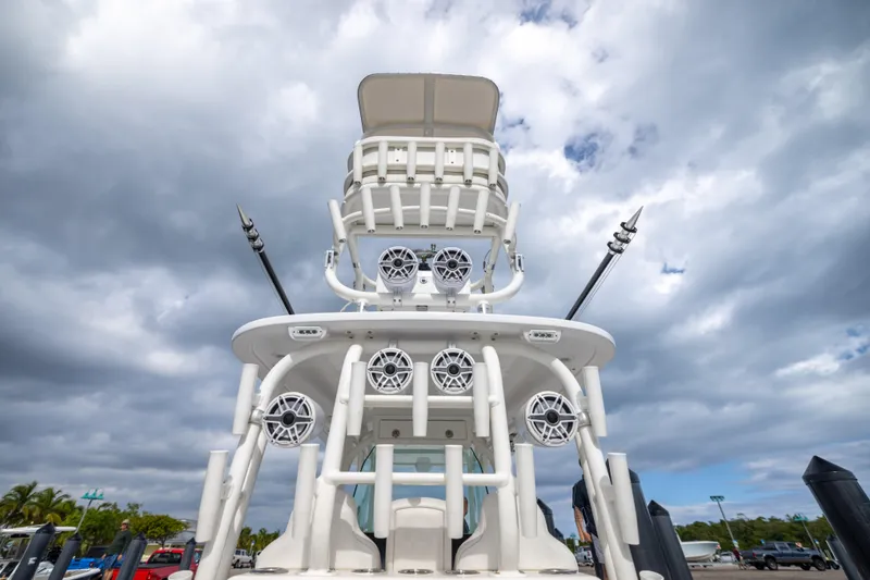 Slide: The Image of 2007 Fountain 34 Center Console boat with tower speakers under cloudy sky. - 17
