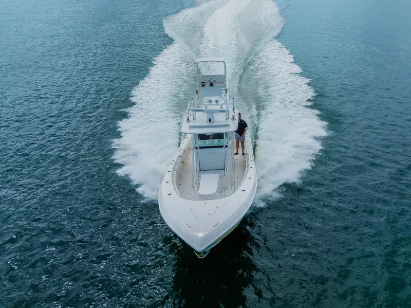 Slide: The Image of 2007 Fountain 34 Center Console boat cruising on open water. - 2