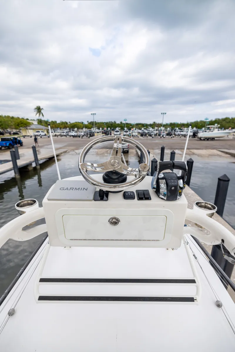 Slide: The Image of 2007 Fountain 34 Center Console boat helm with Garmin equipment at marina. - 20