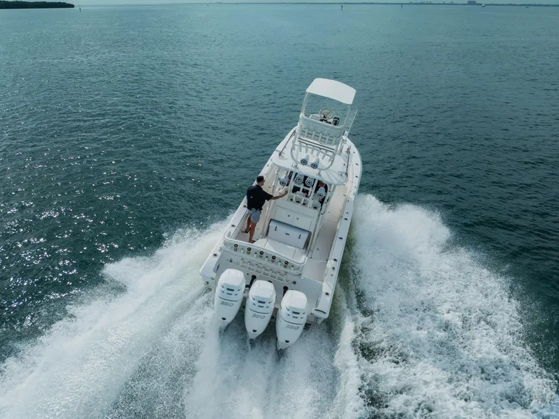 Slide: The Image of 2007 Fountain 34 Center Console boat cruising on open water. - 3