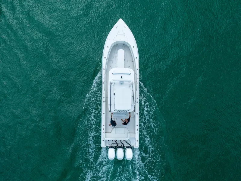 Slide: The Image of Aerial view of 2007 Fountain 34 Center Console boat cruising on open water. - 5